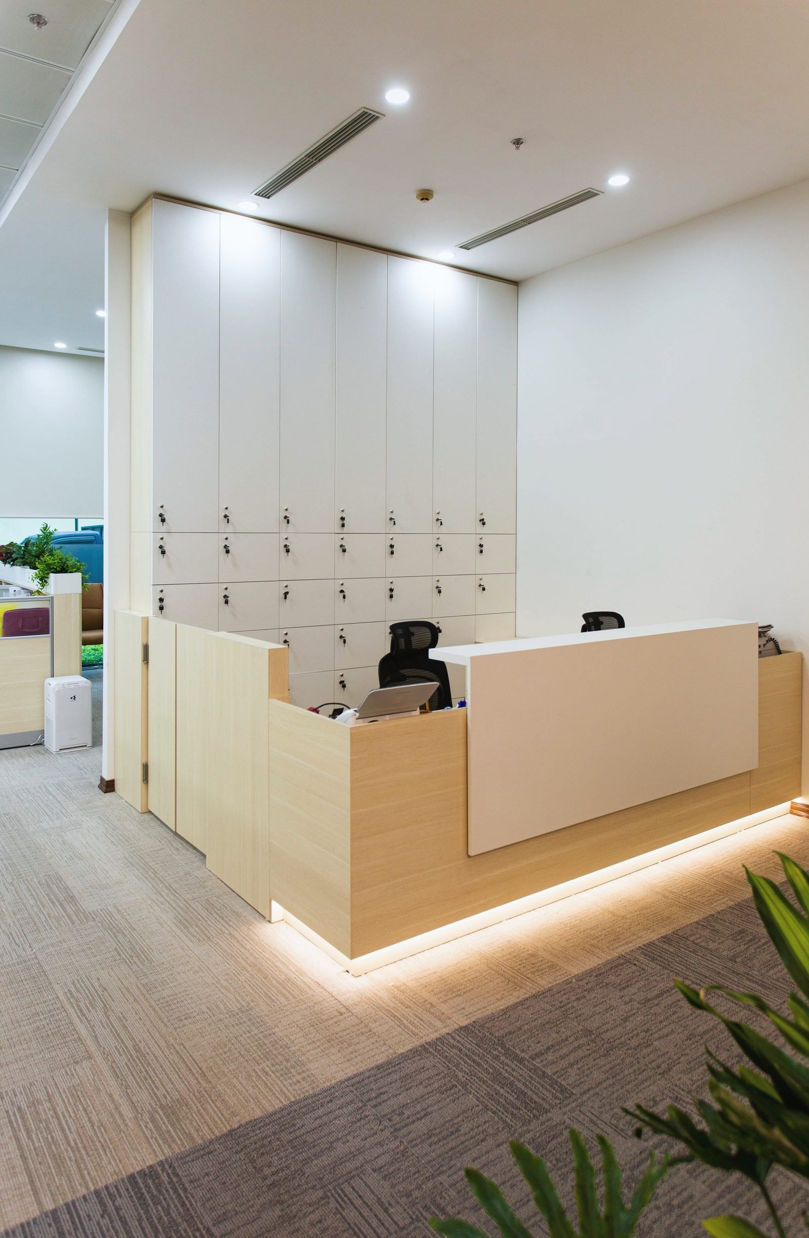 An unattended reception desk with cabinetry behind it